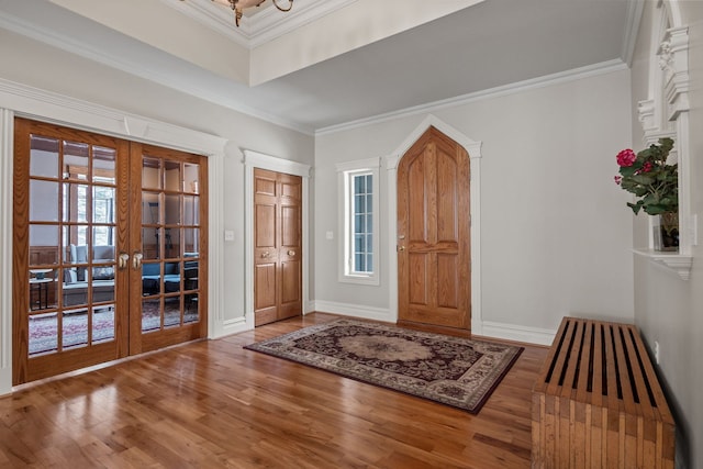 6705 College Park, Clarkston, MI 48346 - entrance foyer with french doors, baseboards, crown molding, and wood finished floors
