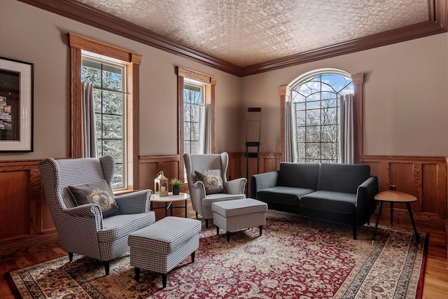 6705 College Park, Clarkston, MI 48346 - living area featuring crown molding, wood finished floors, and a wainscoted wall