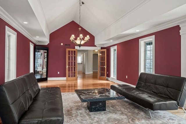 6705 College Park, Clarkston, MI 48346 - living area with visible vents, a notable chandelier, ornamental molding, wood finished floors, and lofted ceiling