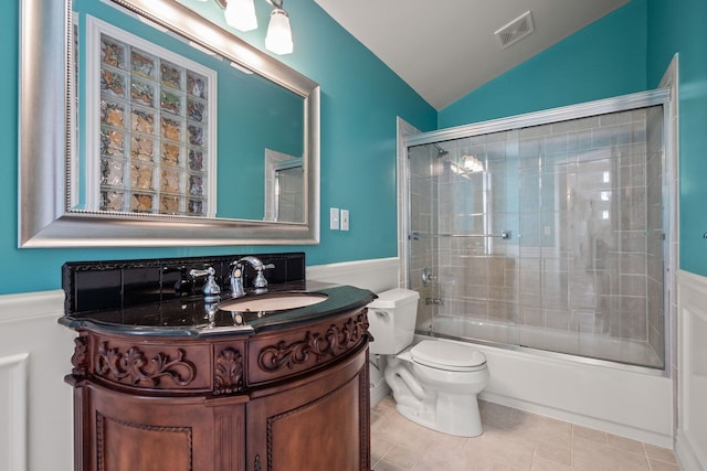 6705 College Park, Clarkston, MI 48346 - bathroom with vanity, vaulted ceiling, toilet, a wainscoted wall, and visible vents