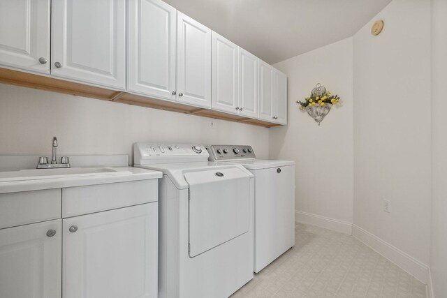 6705 College Park, Clarkston, MI 48346 - laundry room featuring baseboards, washer and dryer, a sink, cabinet space, and light floors