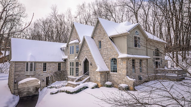 view of snowy exterior featuring board and batten siding