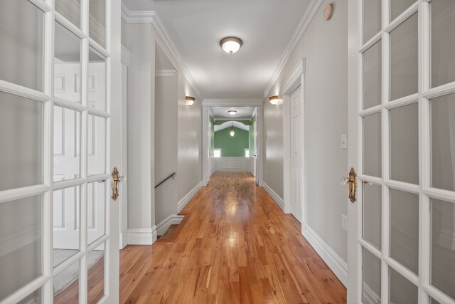 6705 College Park, Clarkston, MI 48346 - corridor featuring light wood finished floors, baseboards, and crown molding