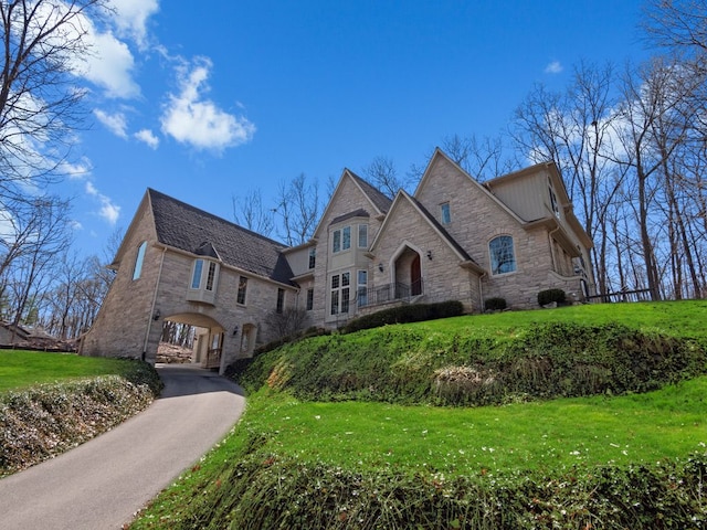 6705 College Park, Clarkston, MI 48346 - french country home with a front yard and stone siding