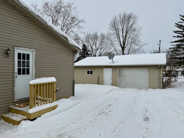 exterior space with a garage and an outdoor structure