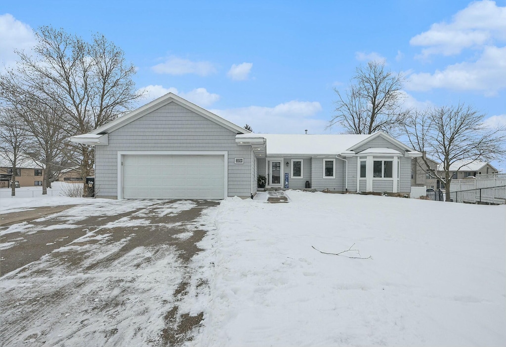 single story home with a garage