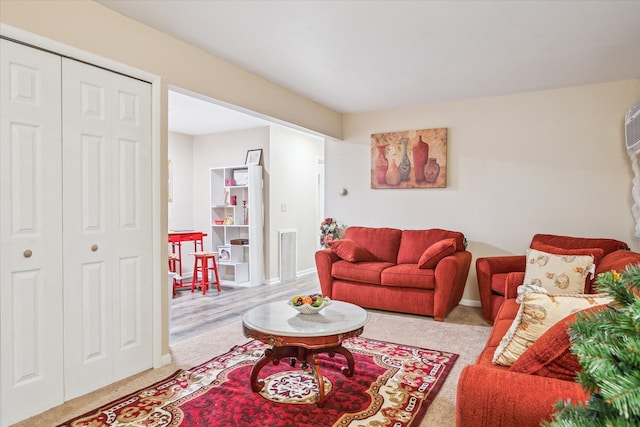 living room featuring visible vents and baseboards