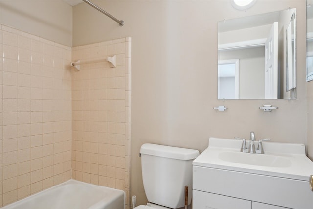 bathroom featuring  shower combination, vanity, and toilet