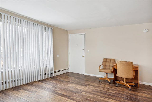 living area featuring a baseboard radiator, baseboards, and dark wood finished floors