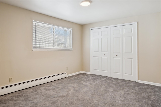 unfurnished bedroom featuring a closet, a baseboard radiator, carpet flooring, and baseboards