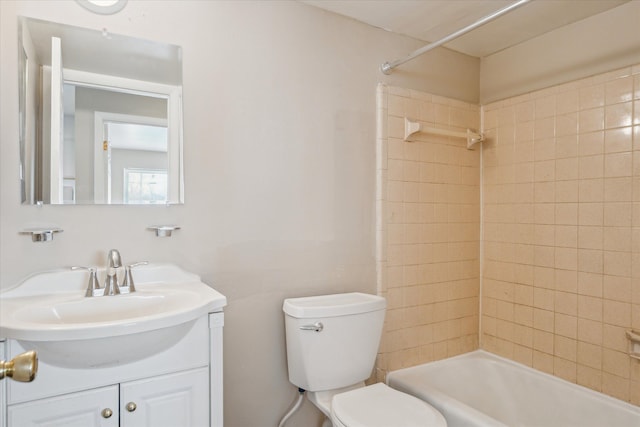 bathroom with shower / washtub combination, vanity, and toilet