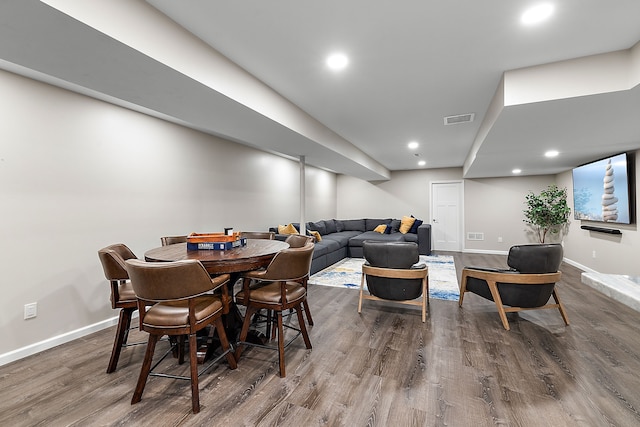 dining space featuring hardwood / wood-style floors