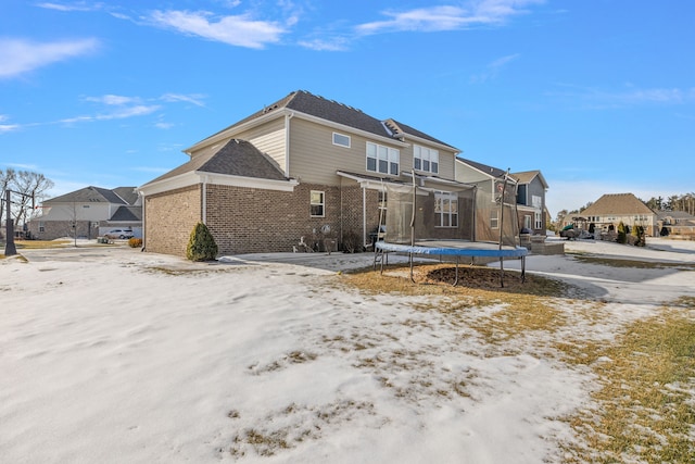 view of snow covered house