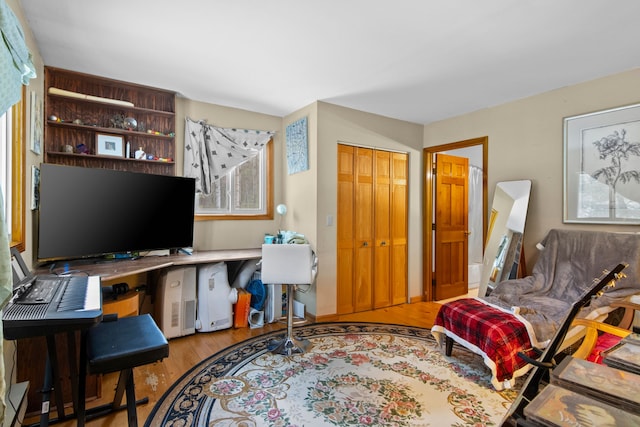 3232 5 Mile Rd, Traverse City, MI 49686 - home office featuring built in study area and wood finished floors