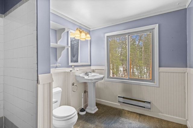 3232 5 Mile Rd, Traverse City, MI 49686 - bathroom with a wainscoted wall, ornamental molding, wood finished floors, and toilet