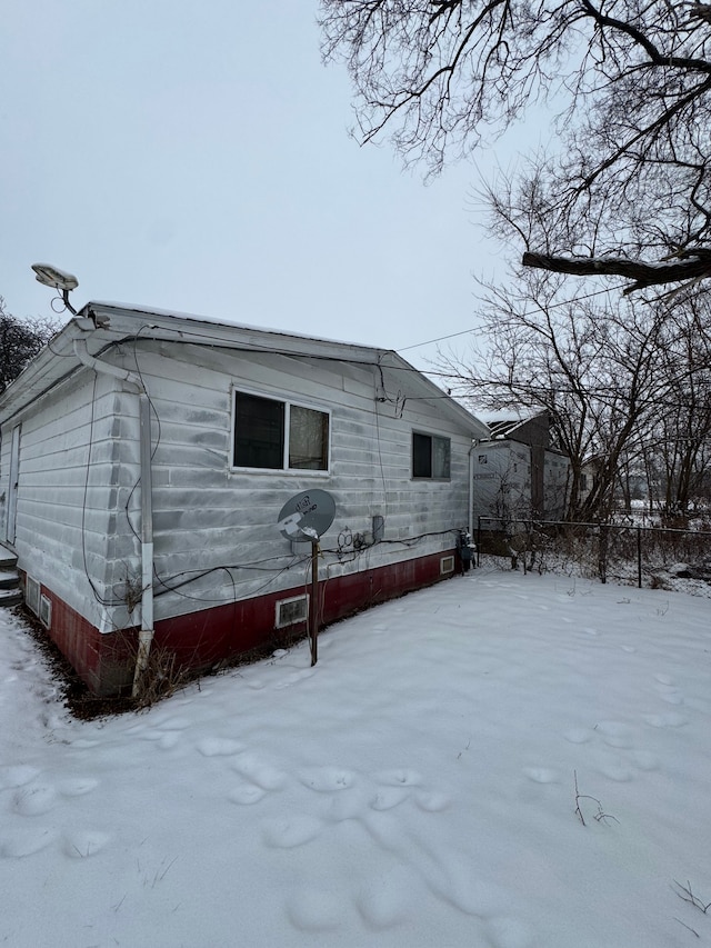 view of snow covered property