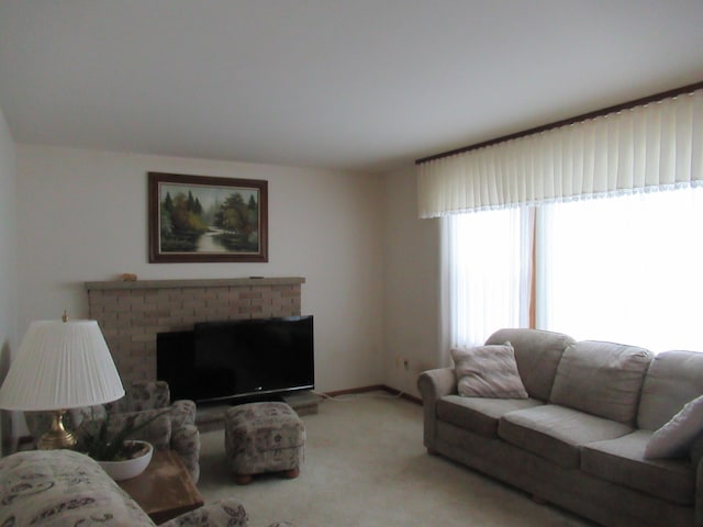 carpeted living room with a fireplace