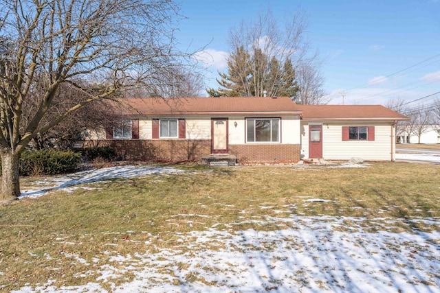 ranch-style home with a lawn