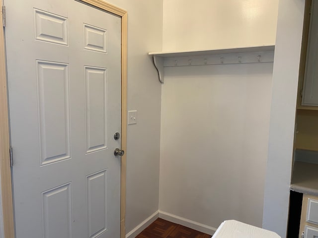 mudroom with dark parquet floors