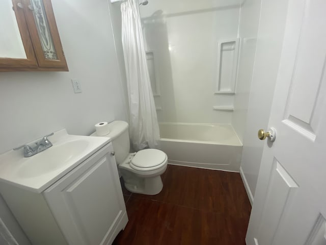 full bathroom with toilet, wood-type flooring, vanity, and shower / tub combo