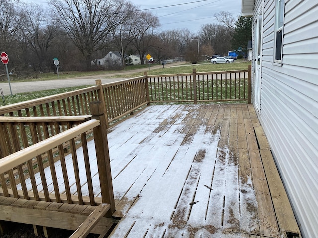 wooden terrace featuring a yard