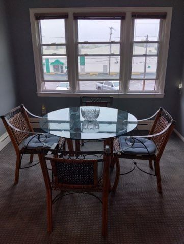 22673 Garrison St Unit 208, Dearborn, MI 48124 - carpeted dining area with baseboards