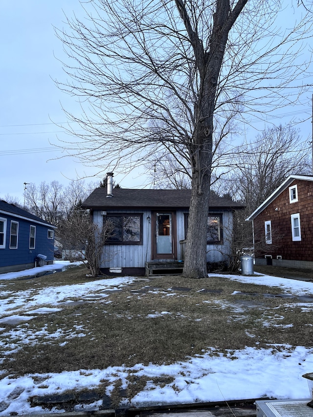 view of front of home featuring a chimney