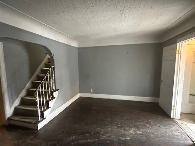 interior space with a textured ceiling