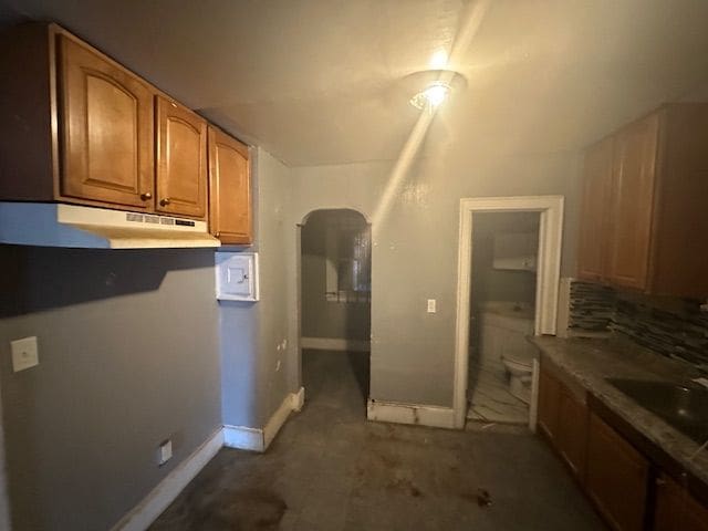 kitchen featuring sink and backsplash