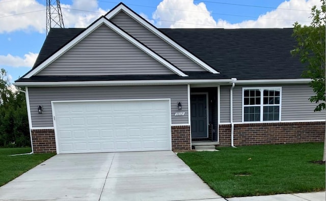 view of front of property featuring a garage, driveway, brick siding, and a front lawn