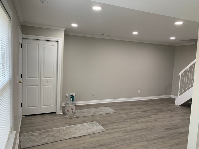 interior space featuring crown molding and hardwood / wood-style floors