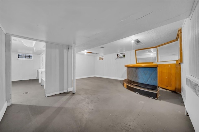 basement featuring radiator heating unit