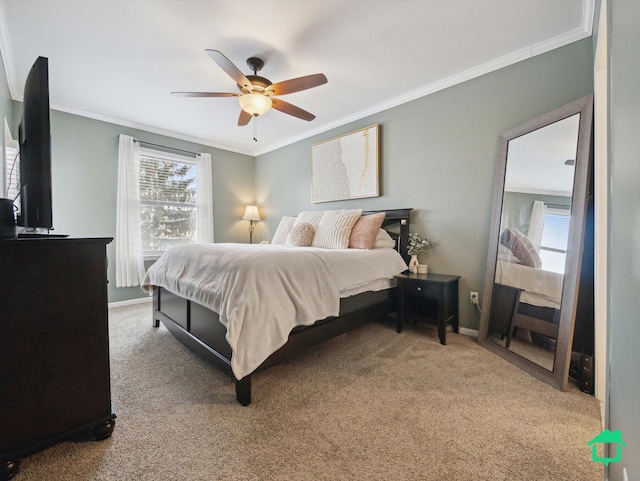 carpeted bedroom featuring ceiling fan and crown molding