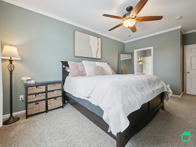 carpeted bedroom featuring ceiling fan and crown molding