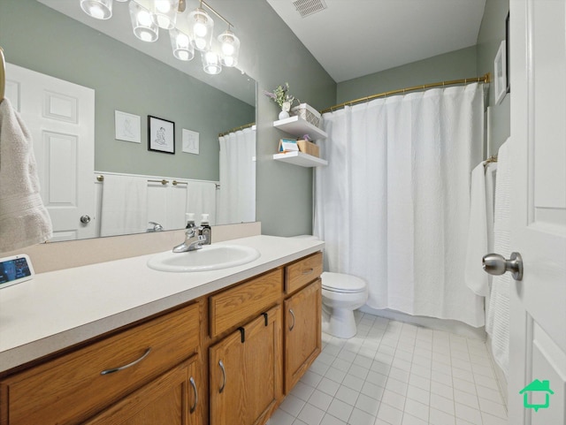 bathroom featuring tile patterned floors, toilet, and vanity