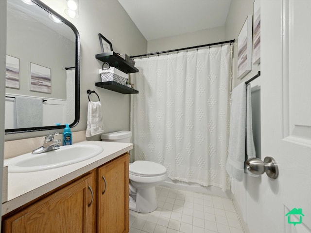 bathroom featuring toilet, tile patterned flooring, and vanity