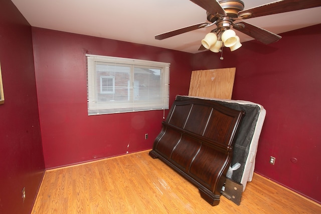 bedroom with light wood finished floors and ceiling fan