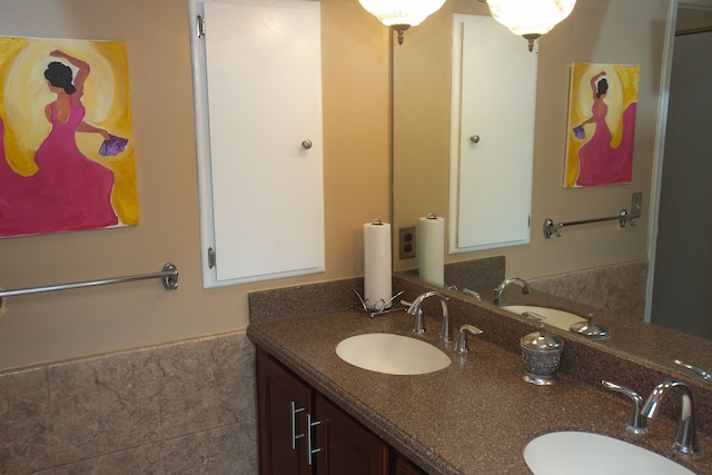 bathroom featuring double vanity and a sink