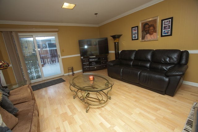 living room with light wood finished floors, baseboards, and crown molding