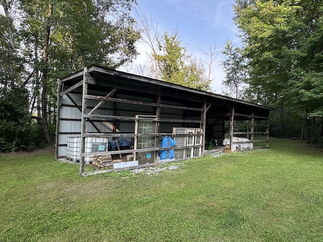 view of outdoor structure with a lawn