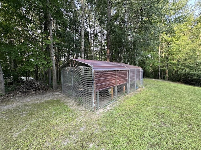 view of outbuilding with a lawn