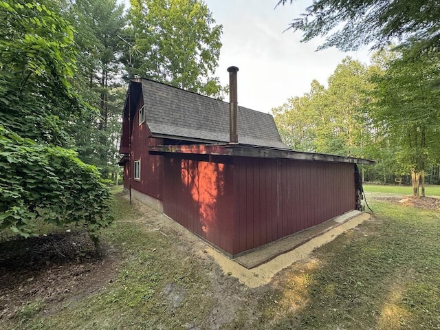 view of property exterior featuring an outdoor structure