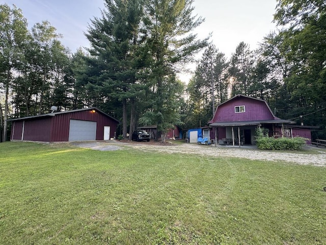 view of yard with an outbuilding and a garage