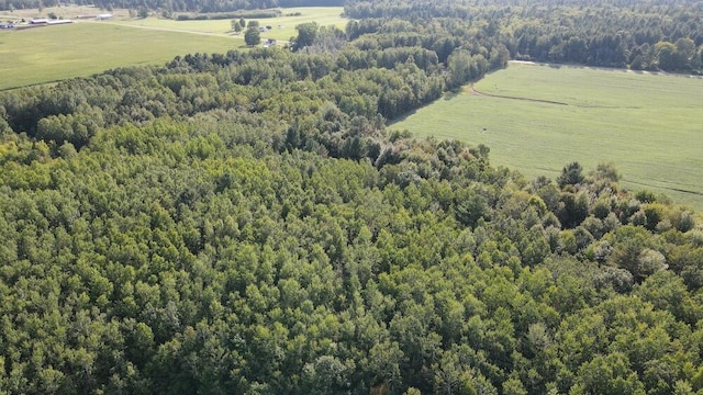 birds eye view of property with a rural view