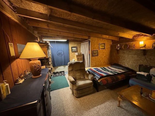 interior space featuring beamed ceiling, carpet flooring, and wooden walls