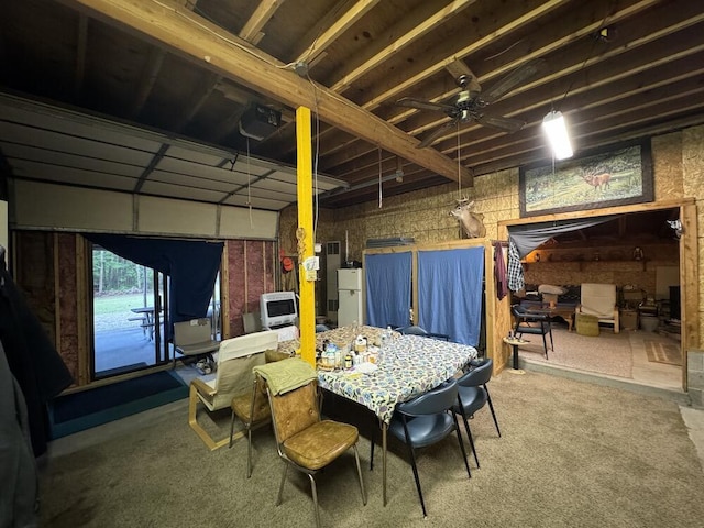 dining space with ceiling fan and carpet floors