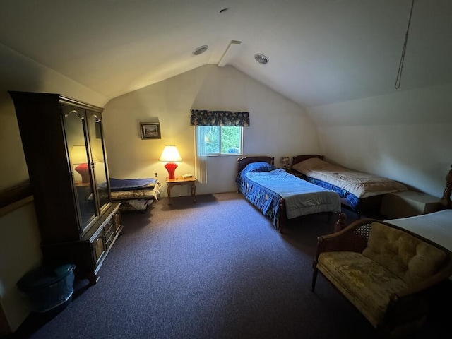 bedroom with lofted ceiling and carpet flooring