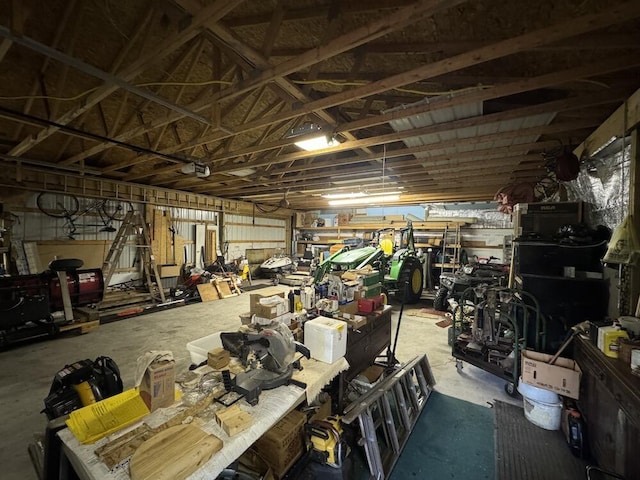 misc room featuring a workshop area and concrete floors