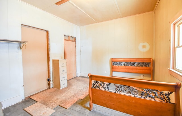 bedroom with hardwood / wood-style flooring