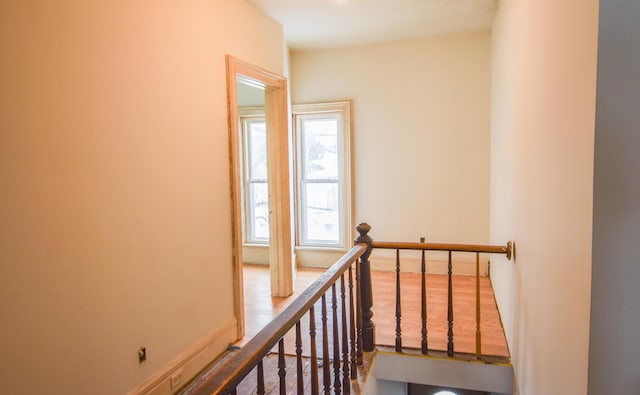 hall with hardwood / wood-style floors